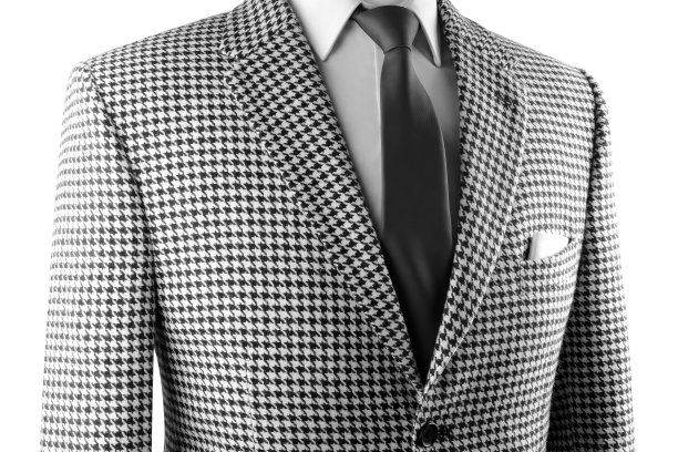 猎犬牙粗花呢夹克与黑色领带和白色方口袋。图片下载
