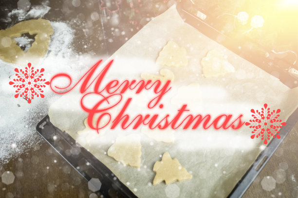 背景与姜饼饼干和漂亮的文字“圣诞快乐”。图片下载