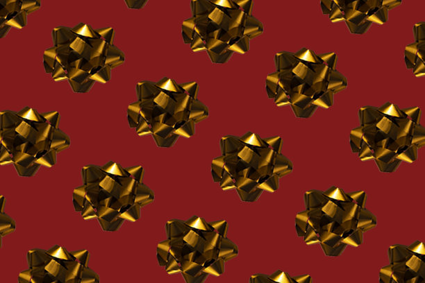 圣诞红色背景上的金色蝴蝶结。图片下载