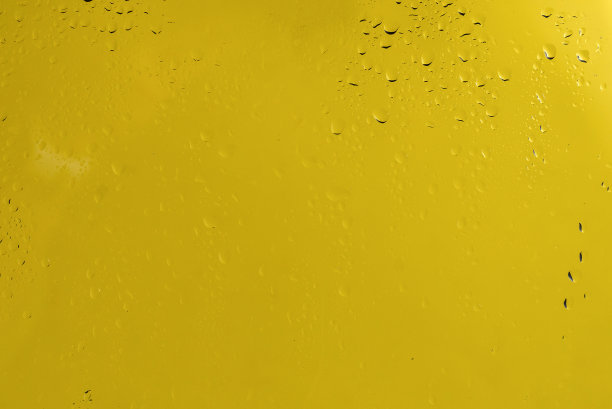 黄色背景与水滴。图片下载
