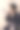 年轻可爱的女性设计师与化妆师腰带和画笔。专业的化妆工具。米色工作室背景。图片下载