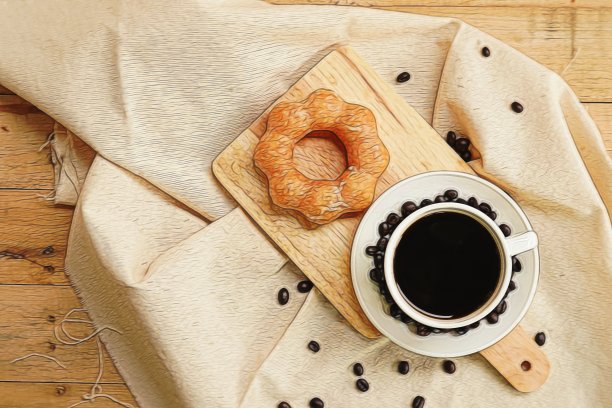 油炸圈饼和咖啡在木桌上的顶视图。图片下载