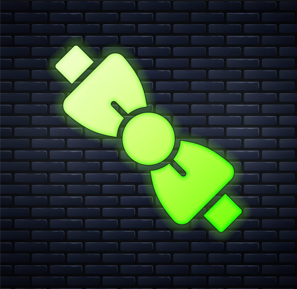 发光的霓虹灯蝴蝶结图标孤立在砖墙背景。向量图片下载