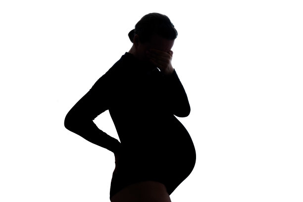 年轻孕妇头痛。怀孕期望的概念。图片下载