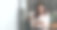 快乐的亚洲妇女戴着无线耳机微笑与数码平板电脑素材图片