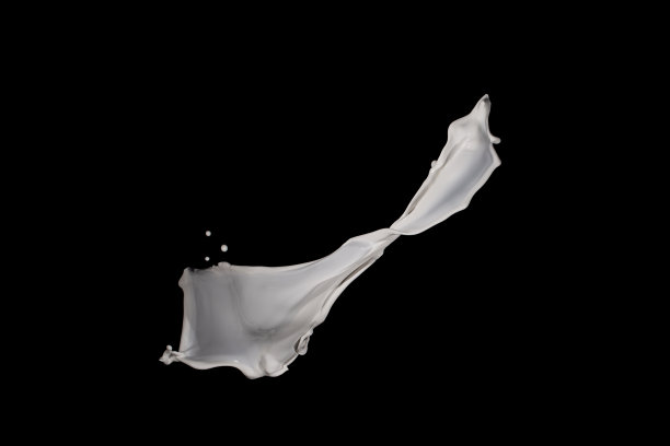 白色油漆飞溅孤立在黑色背景上。图片下载