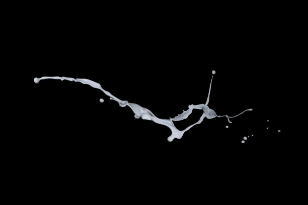 白色油漆飞溅孤立在黑色背景上。图片下载