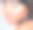 工作室拍摄的一个迷人的年轻女子，在灰色的背景下，给她的脸涂上不同色调的粉底图片下载