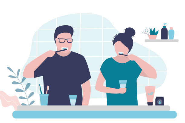 夫妇在浴室刷牙。男人和女人都注意口腔卫生。女孩和男孩一起做早上的例行公事图片下载