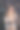 迷人的黑发女人的肖像在米色针织毛衣附近的圣诞树在黑暗的房间。新年的主题。舒适的节日和庆典图片下载