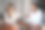 会议照片中，一名亚洲中国女性与印度男同事讨论平板电脑图片下载
