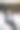 一个年轻人穿着一件经典的夹克，双手放在脑后，坐在椅子上休息。图片下载