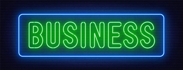 商业霓虹灯在砖墙背景上图片下载