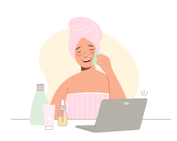 网上美容的概念。在笔记本电脑上查看在线课程。年轻的女人用毛巾遮着她的脸。她用玉水粉刮刀按摩。图片下载