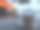 近景照片:桌上端着一杯热巧克力牛奶，落日余辉映衬着苏拉玛杜大桥下的海岸线。图片下载
