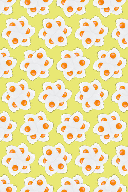 黄色背景上的煎鸡蛋的创意照片图片下载