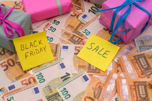 文本黑色星期五与欧元货币的礼品盒贴纸作为背景图片下载