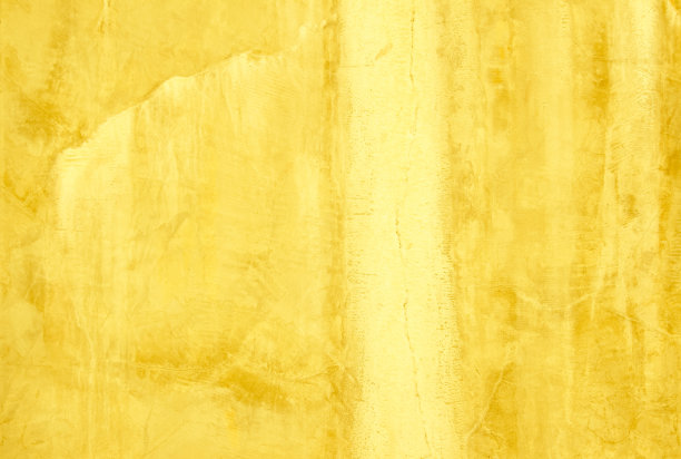 混凝土墙黄色为纹理背景。抽象的grunge明亮的彩色背景与增长的效果。淡黄色，低对比度，粗糙和不规则。图片下载