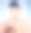 工作室拍摄的一个迷人的年轻女子使用香水在蓝色的背景图片下载