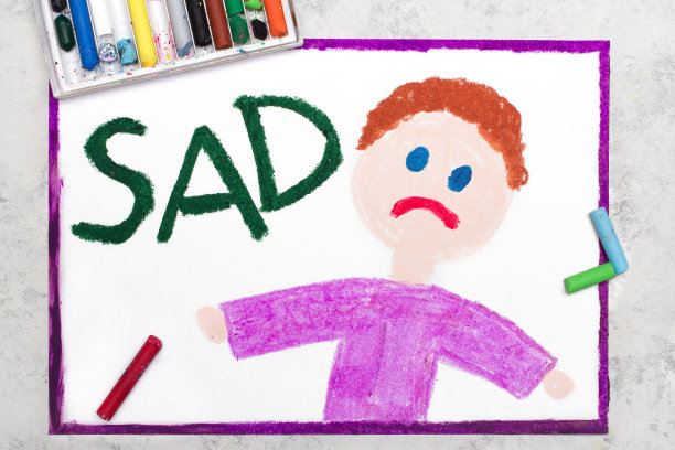 彩色图画:悲伤的男孩和单词Sad图片下载
