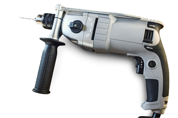 小电钻与钻在白色背景上。图片下载