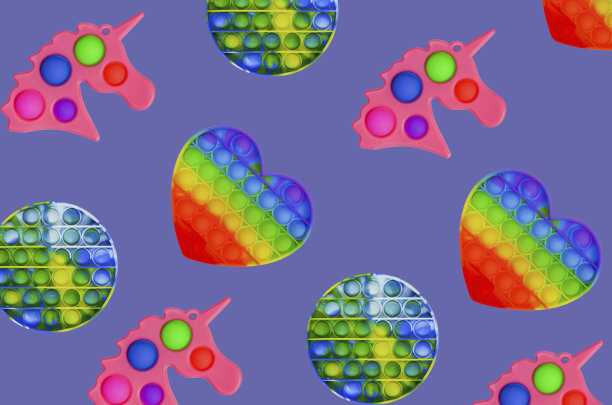 Pop它烦躁的玩具独角兽孤立在时尚非常接近2022年的颜色背景，彩色无缝简单的酒窝图案图片下载