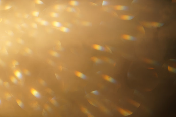 暖黄色灯光效果的背景，彩虹点，从上方的角度图片下载