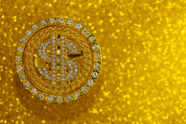 金元符号与宝石在黄色闪光的背景图片下载