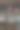 在一个多云的夜晚，三座现代化的摩天大楼矗立在河边。图片下载