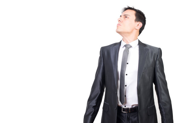 诚实的年轻商人在白色的画室里看着别处图片下载