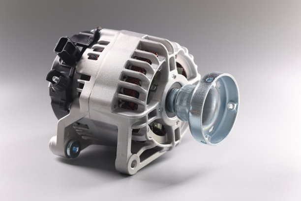 特写的汽车零件的发电机在灰色的背景图片下载