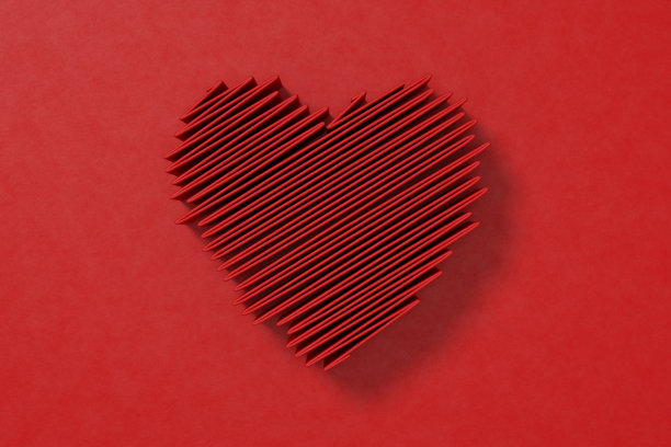 情人节切成心形放在红色背景上图片下载