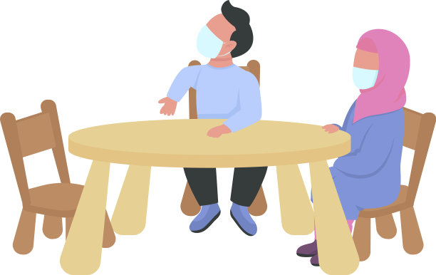 戴着面具的学龄前儿童坐在半桌子旁图片下载