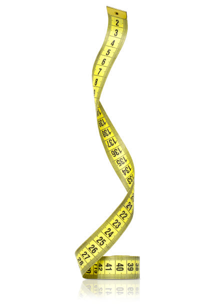 白色背景上的黄色卷尺图片下载