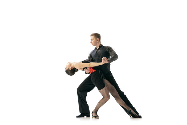 优雅和美丽的舞者，年轻的夫妇跳舞阿根廷探戈孤立在白色的工作室背景。穿着黑色舞台服装的艺术家图片下载