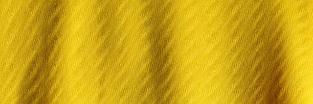 面料底色为黄色，面料为聚酯纤维纹理。宽横幅图片下载
