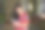 迷人的亚洲女性穿着橙色t恤在家里使用智能手机。开朗的女孩在社交网络上打字图片下载