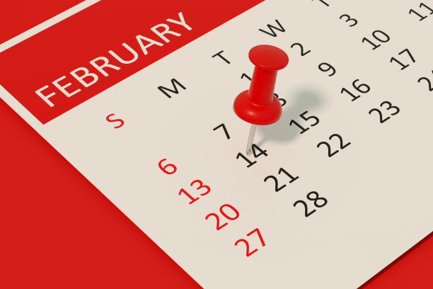 红色背景日历上的2月14日情人节图片下载