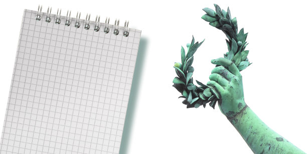 成功和名声的笔记-概念与手握月桂花环和笔记本图片下载