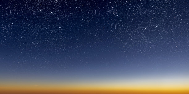 一个美丽的黎明太阳与星星，从蓝色渐变到红色图片下载