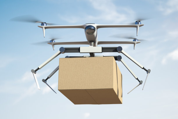 飞行快递机器人在目的地投递货物图片下载