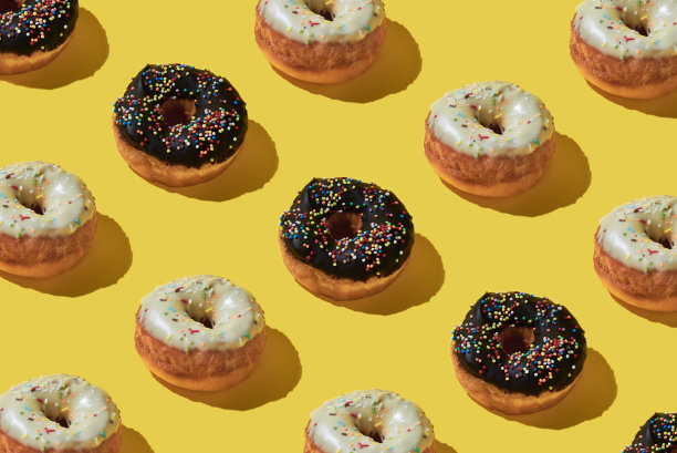 甜甜圈重复食品背景。图片下载