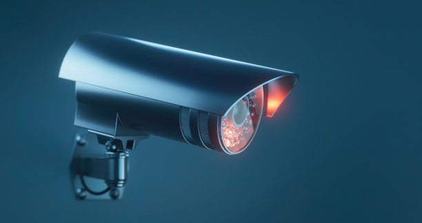 平面设计的安全摄像头在一个蓝色的背景图片下载