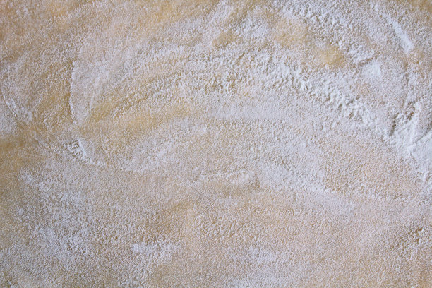 面团和面粉。特写镜头。背景。纹理。图片下载