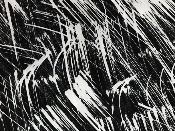 用刷子在黑色背景上画出白色的图案图片下载