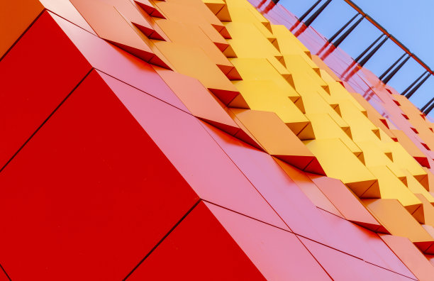 从建筑设计的橙色渐变颜色方块纹理。图片下载