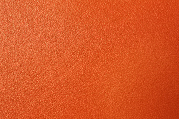 纹理的橙色皮革作为背景，特写图片下载