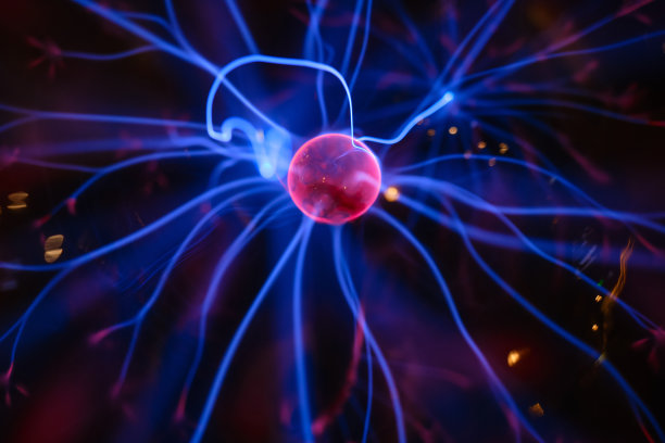 抽象的神经元的背景。在黑暗的背景上闪烁着紫粉色的光图片下载
