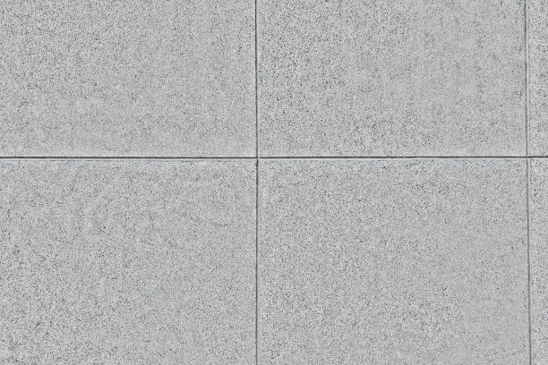 大楼的墙壁上铺着大块的灰色大理石瓷砖。片段。背景或纹理图片下载