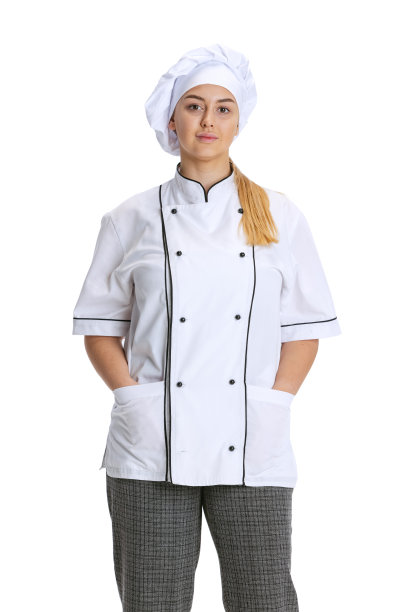 年轻女子，女厨师，厨师穿着白色制服，在白色背景下独自摆姿势。烹饪、专业、经营、美食、口味、餐厅概念。图片下载